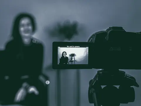 A camera on a tripod filming a video