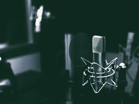 Studio condenser microphone in a dark recording space